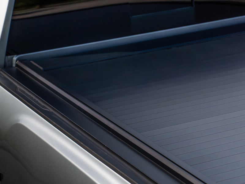 Aluminum slat and side rail detail of the SILVEX retractable tonneau cover, no-drill clamp mounting