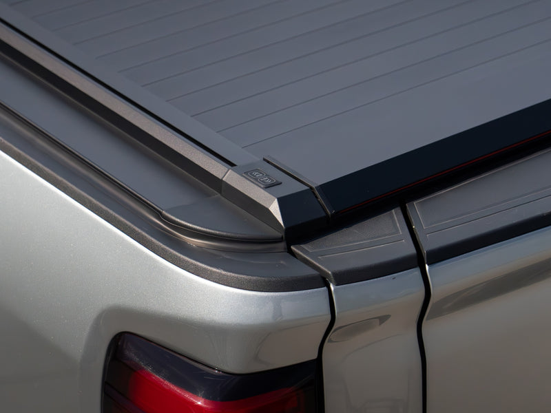 Corner and side rail of the SILVEX tonneau cover next to the truck taillight