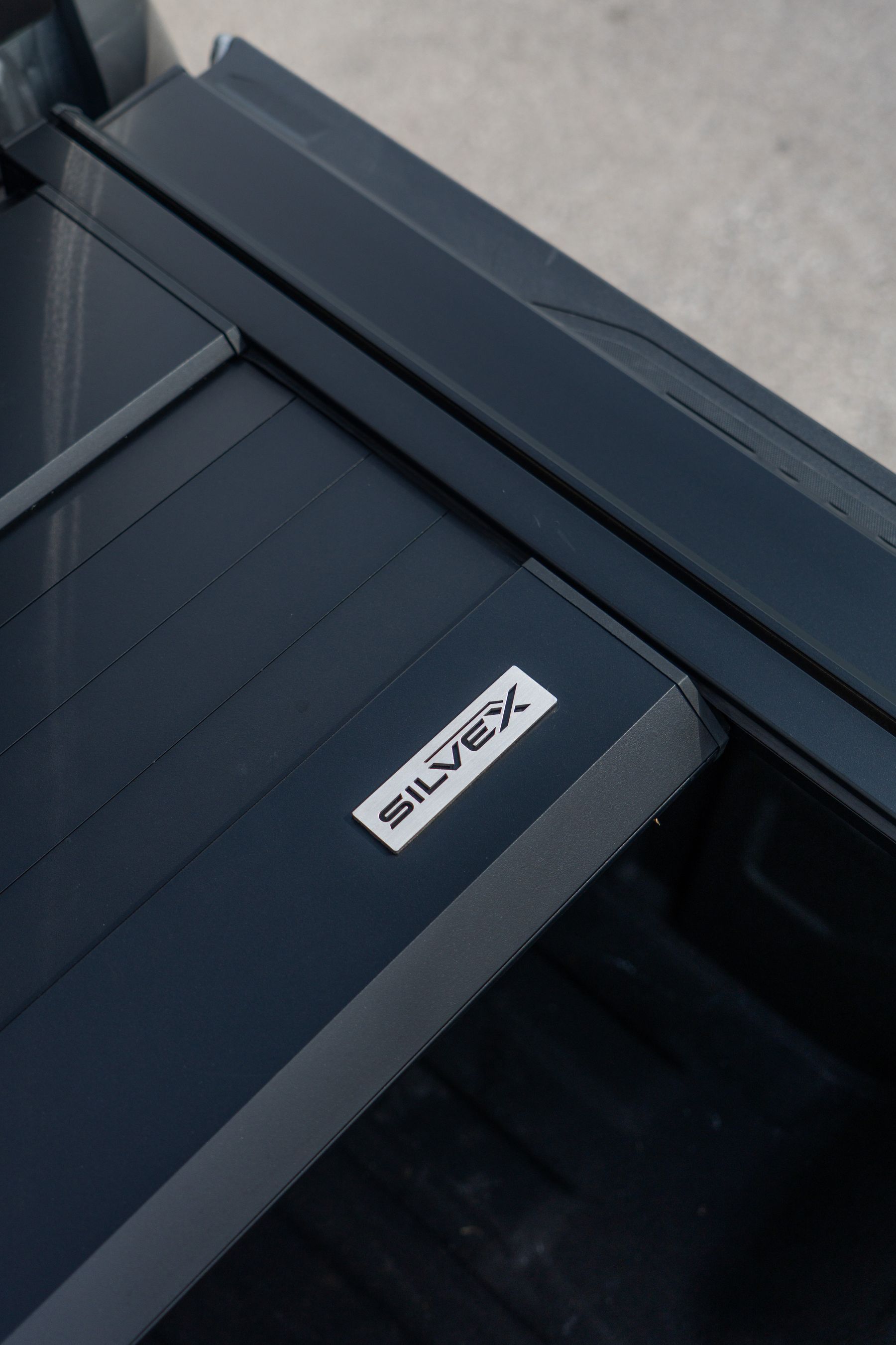 SILVEX badge machined into the cover rail